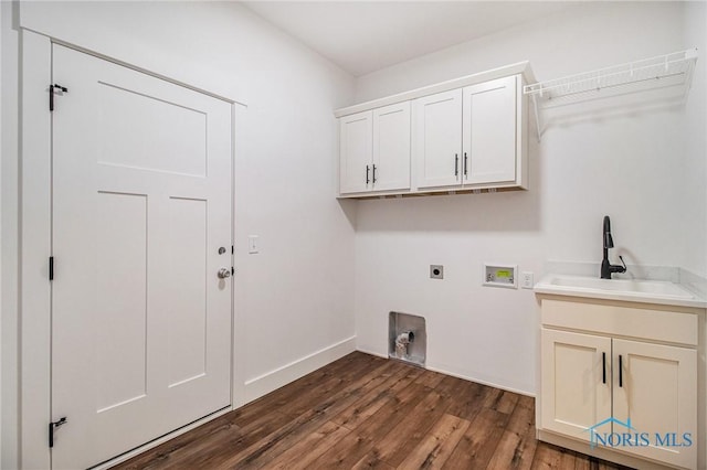 laundry area featuring hookup for an electric dryer, dark hardwood / wood-style floors, hookup for a washing machine, cabinets, and sink