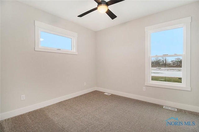 carpeted empty room with ceiling fan