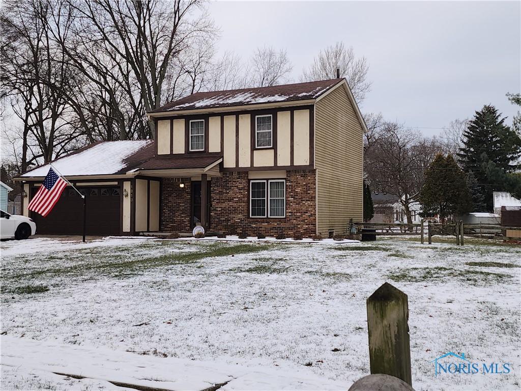 view of front of property with a garage