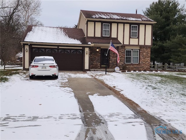 english style home with a garage