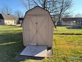 view of outdoor structure with a lawn