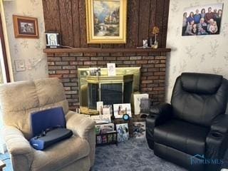 sitting room with dark colored carpet