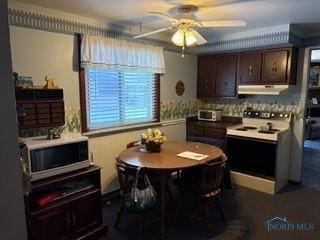 kitchen with range with electric stovetop, ceiling fan, and dark brown cabinetry