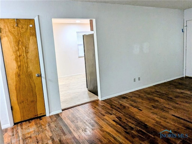 empty room featuring dark hardwood / wood-style floors