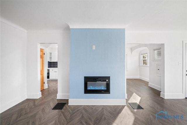 living room with dark parquet flooring