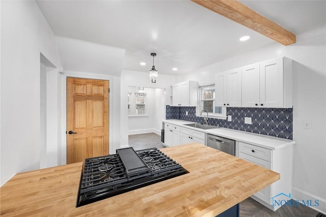 kitchen with sink, hanging light fixtures, dishwasher, black gas stovetop, and white cabinets