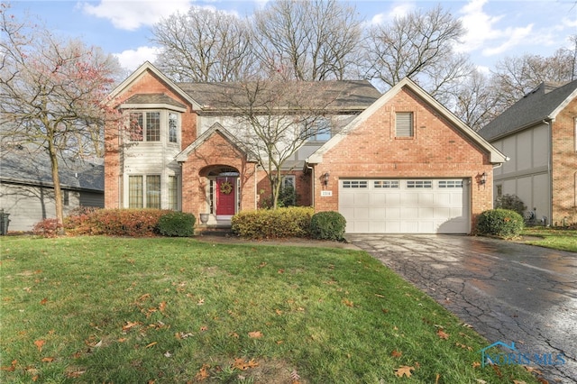 front facade with a garage and a front lawn