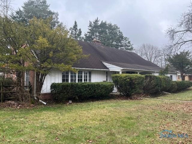 view of home's exterior featuring a lawn