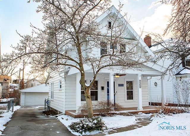 view of front of home featuring a garage and an outdoor structure