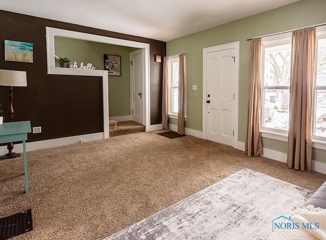 view of carpeted foyer