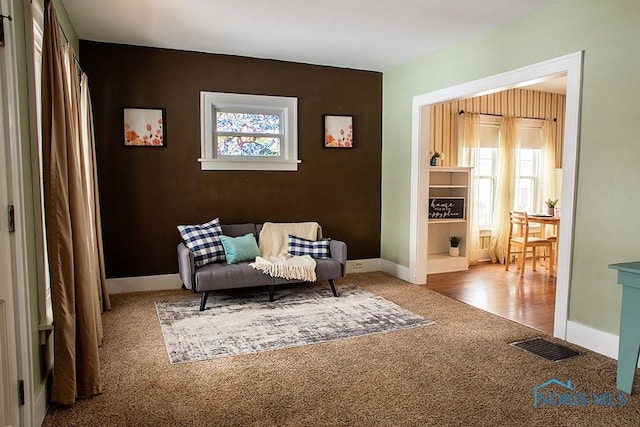 sitting room with light colored carpet