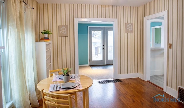 doorway to outside with french doors and hardwood / wood-style floors