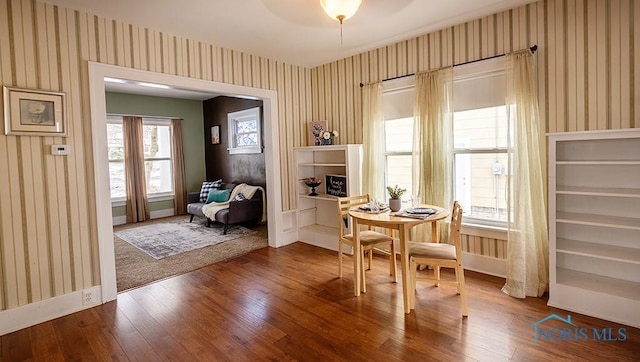 living area with hardwood / wood-style flooring