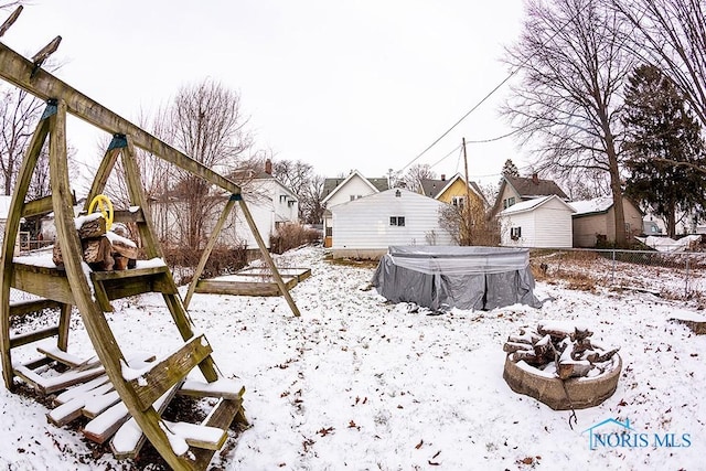 view of yard covered in snow