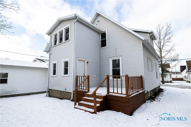 view of snow covered house