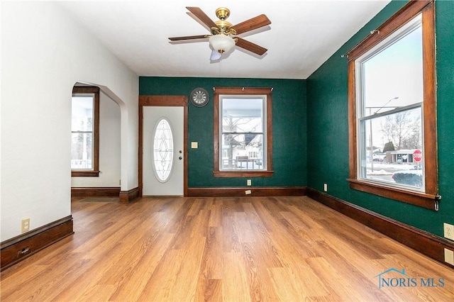 foyer entrance featuring ceiling fan and light hardwood / wood-style floors