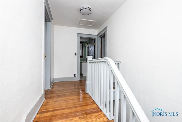 hall with light hardwood / wood-style floors