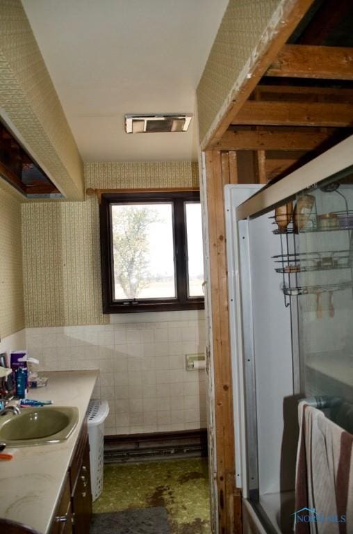 bathroom featuring walk in shower, vanity, and toilet