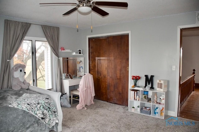 bedroom featuring carpet flooring, a closet, ceiling fan, and multiple windows