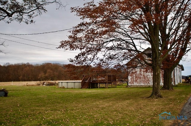 view of yard featuring a swimming pool side deck