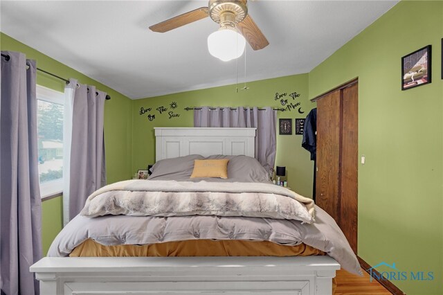 bedroom featuring wood-type flooring and ceiling fan