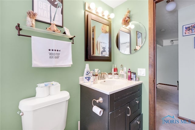 bathroom with vanity and toilet