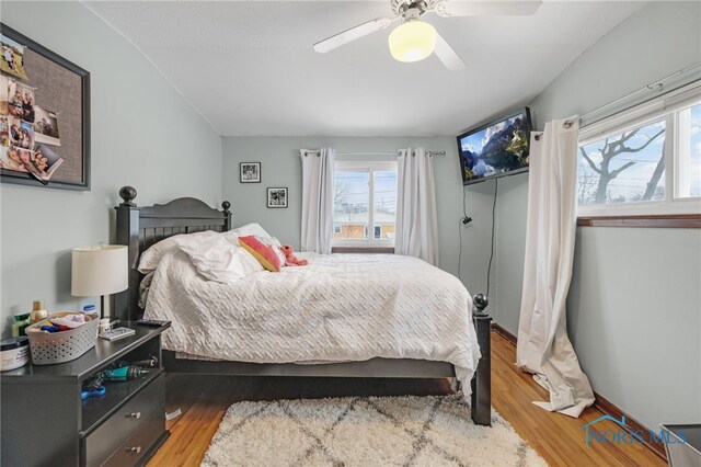 bedroom featuring wood-type flooring and ceiling fan