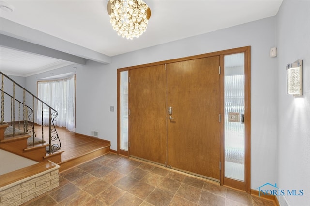 foyer featuring a notable chandelier