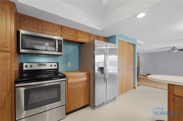 kitchen with ceiling fan and stainless steel appliances