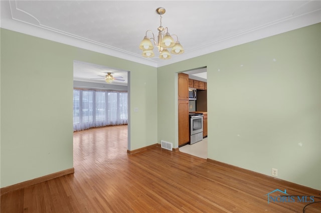 unfurnished dining area featuring ceiling fan with notable chandelier, crown molding, and light hardwood / wood-style flooring