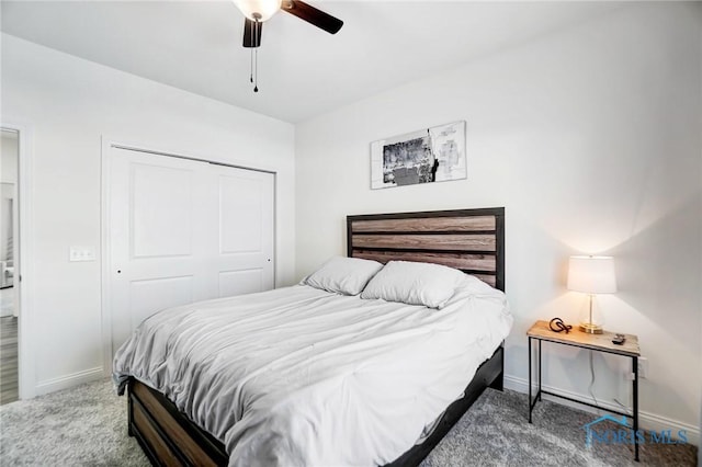 carpeted bedroom featuring ceiling fan and a closet