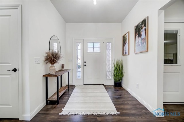 entryway with dark hardwood / wood-style floors