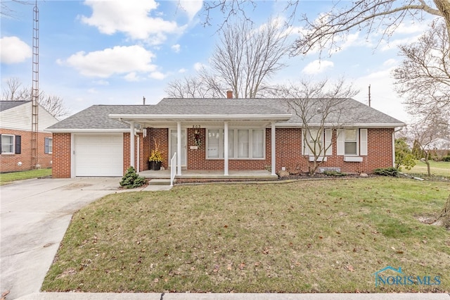 single story home featuring covered porch, a garage, and a front yard