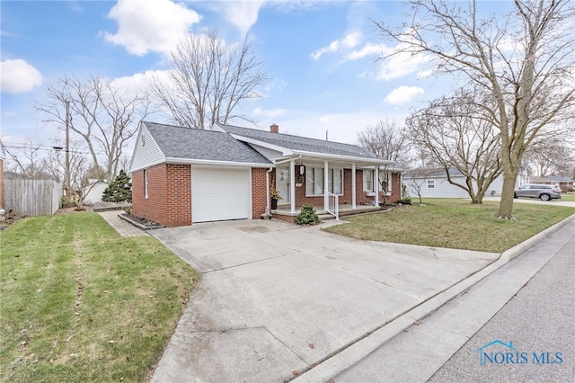 single story home with covered porch, a front yard, and a garage