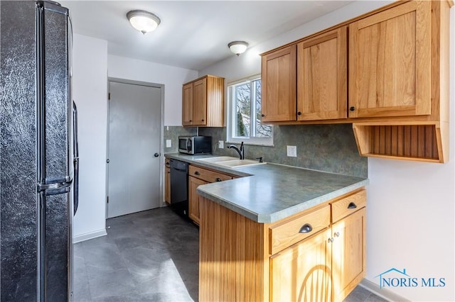 kitchen featuring decorative backsplash, sink, and black appliances