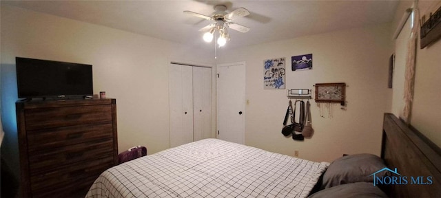 bedroom with ceiling fan and a closet