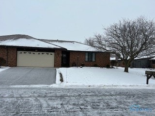 single story home featuring a garage