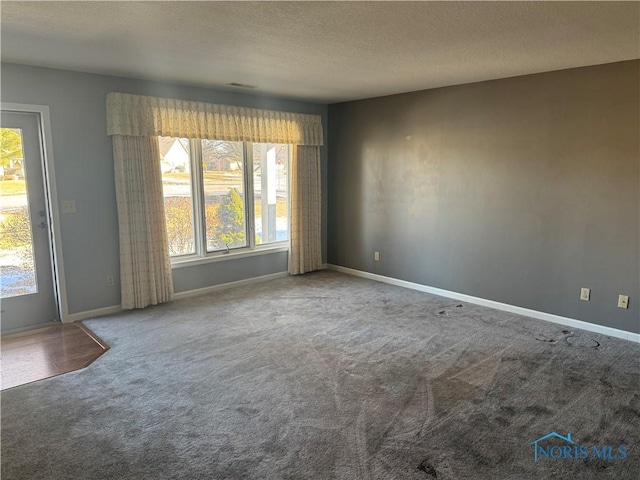 unfurnished room with carpet flooring