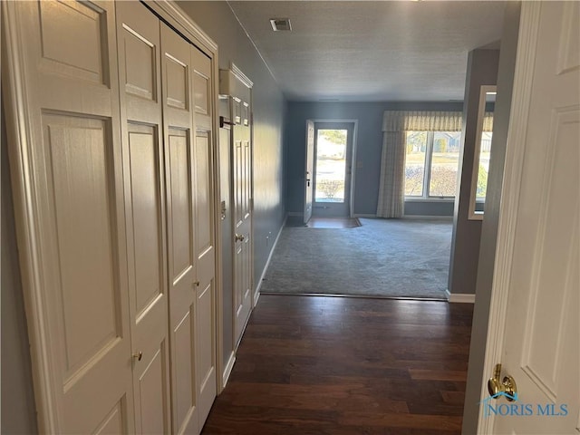 hallway featuring dark hardwood / wood-style flooring