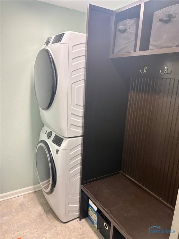 clothes washing area with stacked washer / drying machine