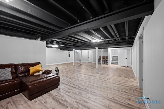 basement featuring light hardwood / wood-style flooring