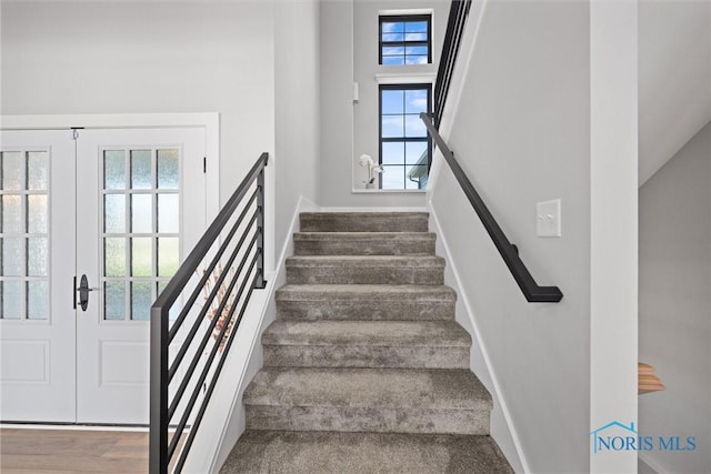 stairway with french doors