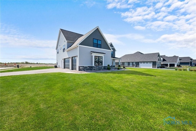 view of front of property with a front lawn and a garage