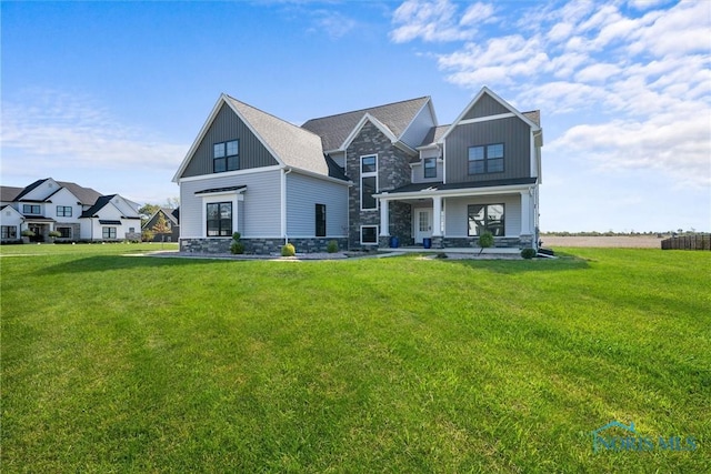 view of front of property featuring a porch and a front yard