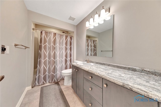 bathroom with vanity, curtained shower, and toilet