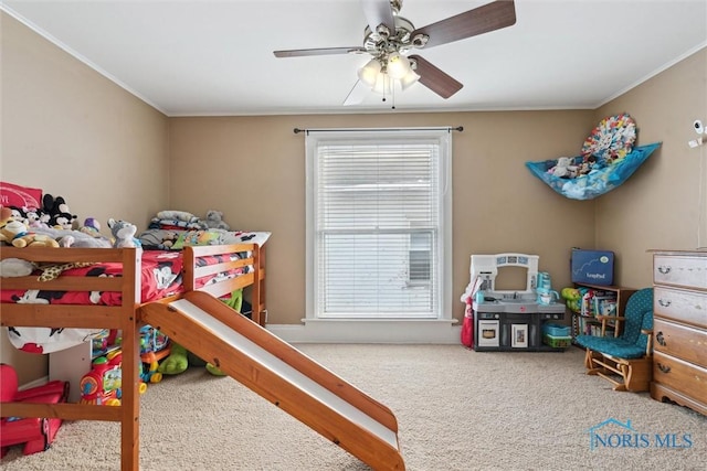 bedroom featuring ceiling fan, carpet, and ornamental molding