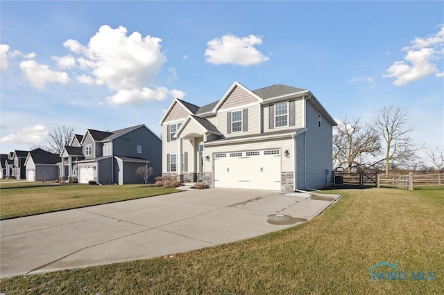 view of front of home with a front lawn and a garage