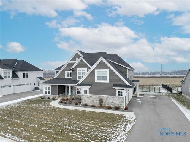 craftsman inspired home featuring a garage