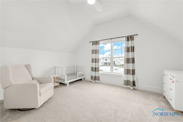 living area with light carpet, vaulted ceiling, and ceiling fan