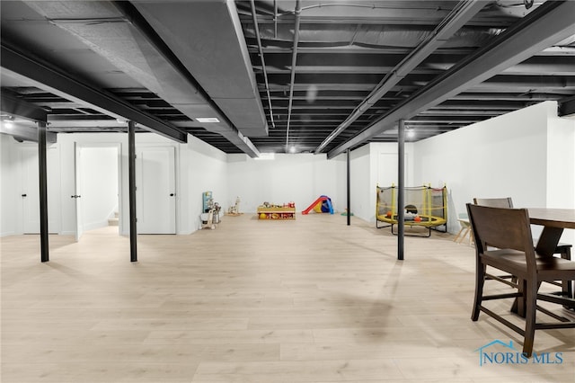 basement with light wood-type flooring